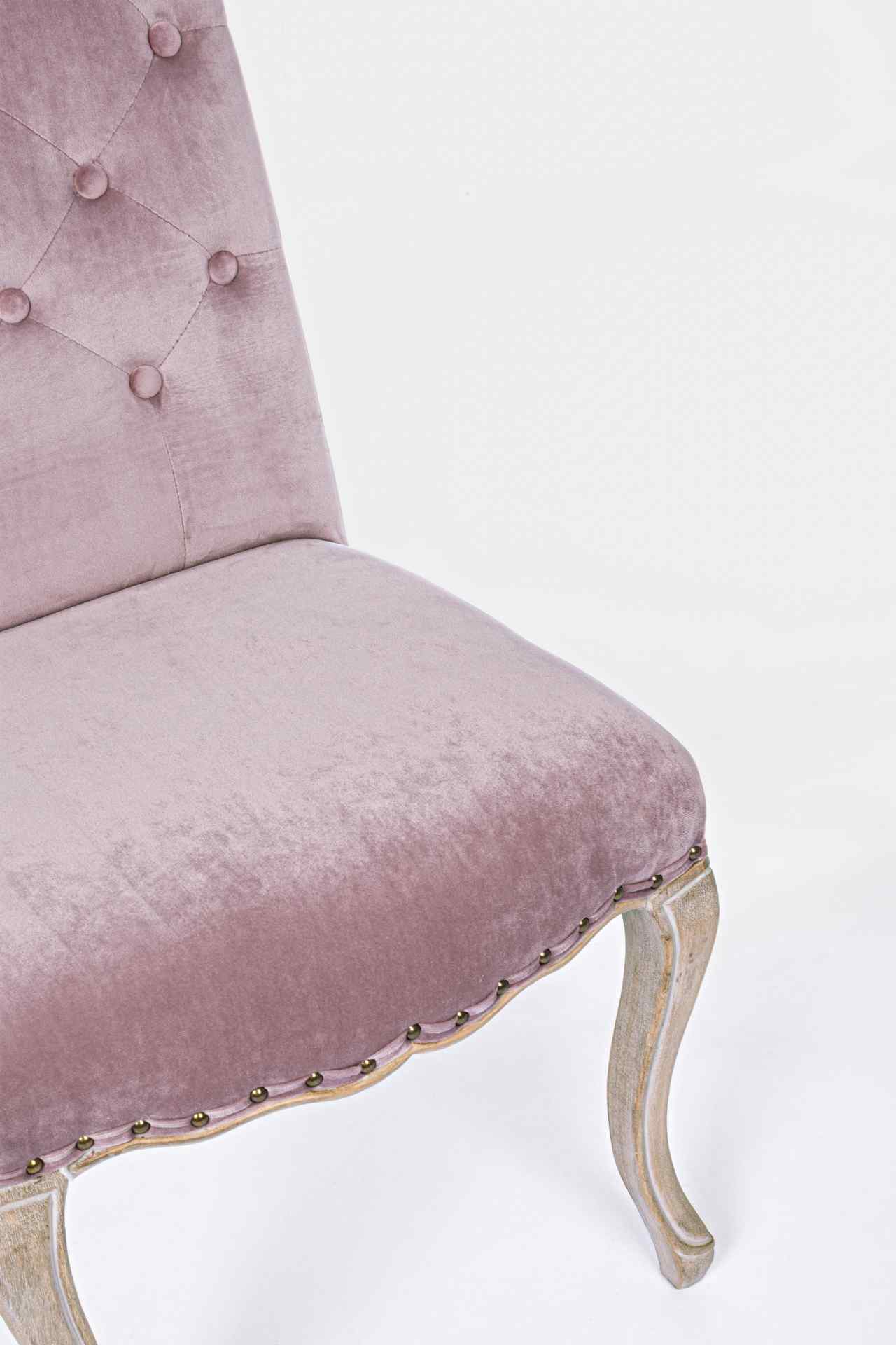 Der Esszimmerstuhl Diva überzeugt mit seinem klassischem Design. Gefertigt wurde der Stuhl aus einem Stoff-Bezug, welcher einen Rosa Farbton besitzt und in einer Samt-Optik ist. Das Gestell ist aus Holz und ist natürlich gehalten. Die Sitzhöhe beträgt 48 
