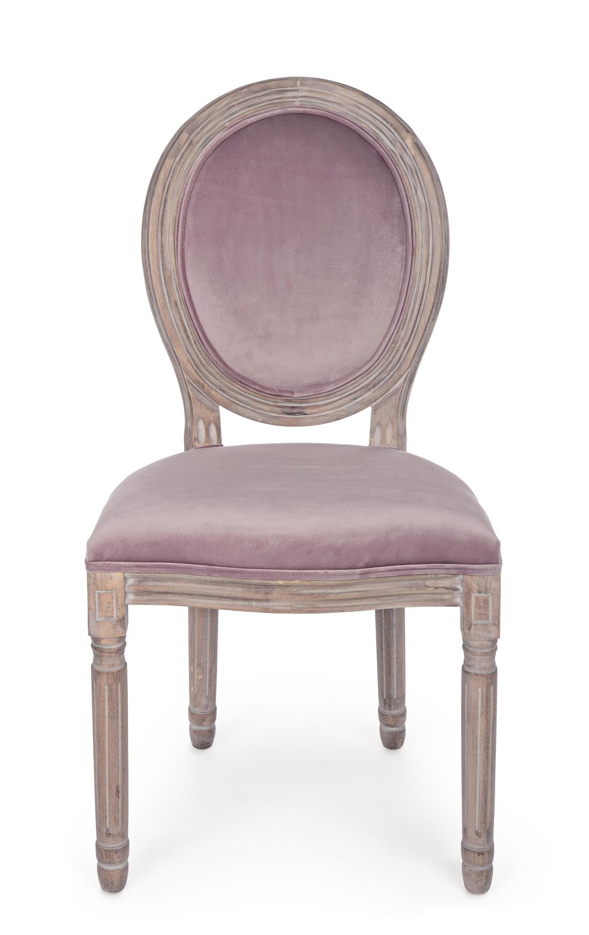 Der Stuhl Mathilde überzeugt mit seinem klassischem Design gefertigt wurde der Stuhl aus Birkenholz, welches natürlich gehalten ist. Die Sitz- und Rückenfläche ist aus einem Stoff-Bezug, welcher einen rosa Farbton besitzt und in einer Samt-Optik ist. Die 
