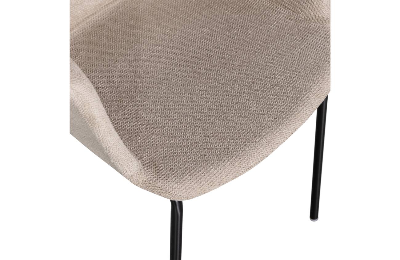 Der Esszimmerstuhl Tieme überzeugt mit seinem modernen Stil. Gefertigt wurde er aus Stoff, welches einen Sand Farbton besitzt. Das Gestell ist aus Metall und hat eine schwarze Farbe. Der Stuhl hat eine Sitzhöhe von 42 cm .